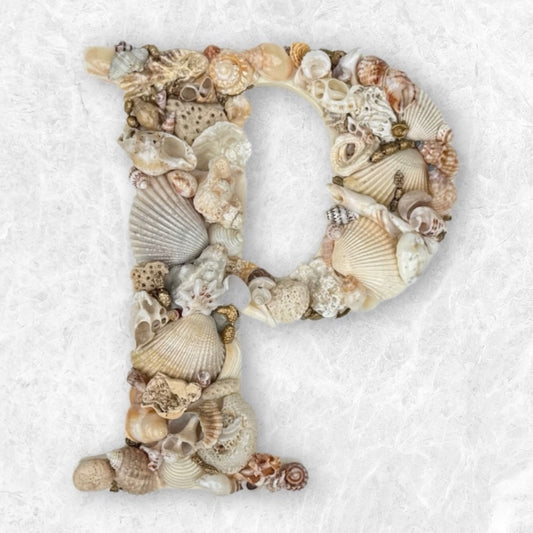 Handmade shell art initial - Warm, neutral and elegant, created with natural beige, white and small gold coated seashells. An unframed personalised coastal keepsake for nursery or bedroom decor, available in all letters and made to order.