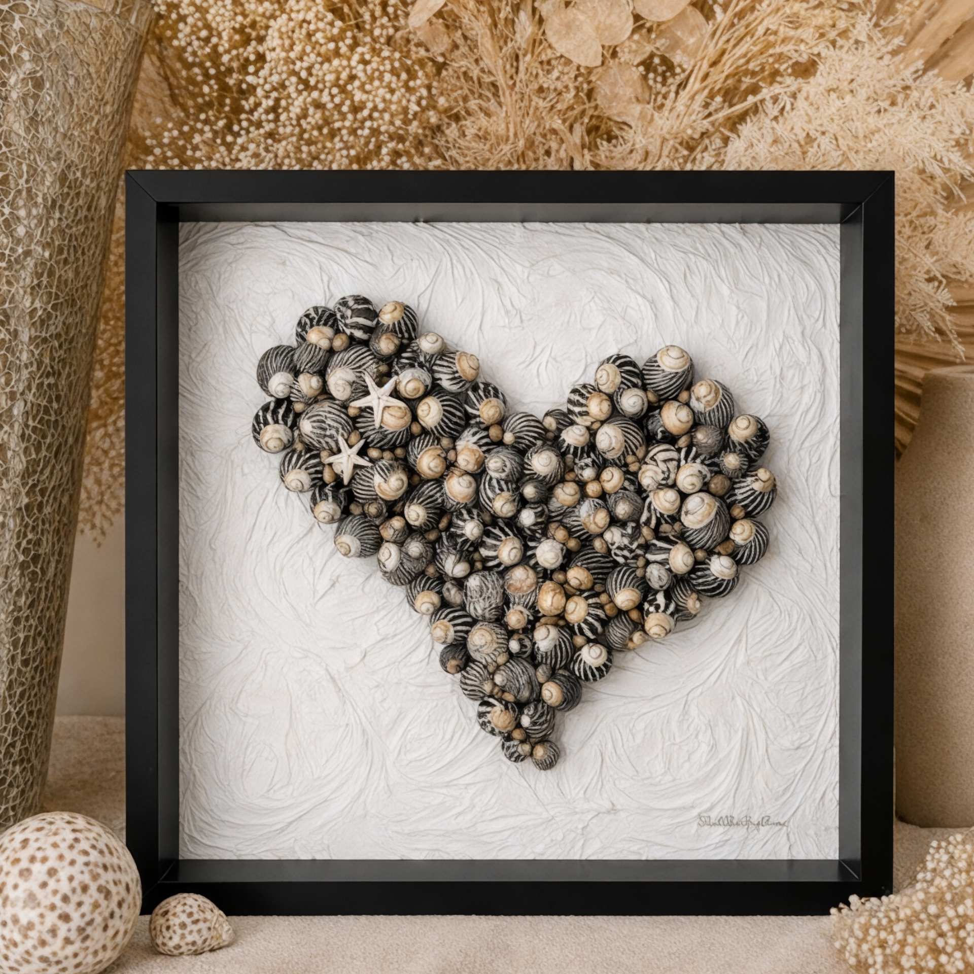 Handmade black and white wall art made from zebra sea snails and starfish in a black shadow box frame with textured background. Coastal wall art keepsake  for Mother’s Day, Valentine’s Day, Birthday gift. 