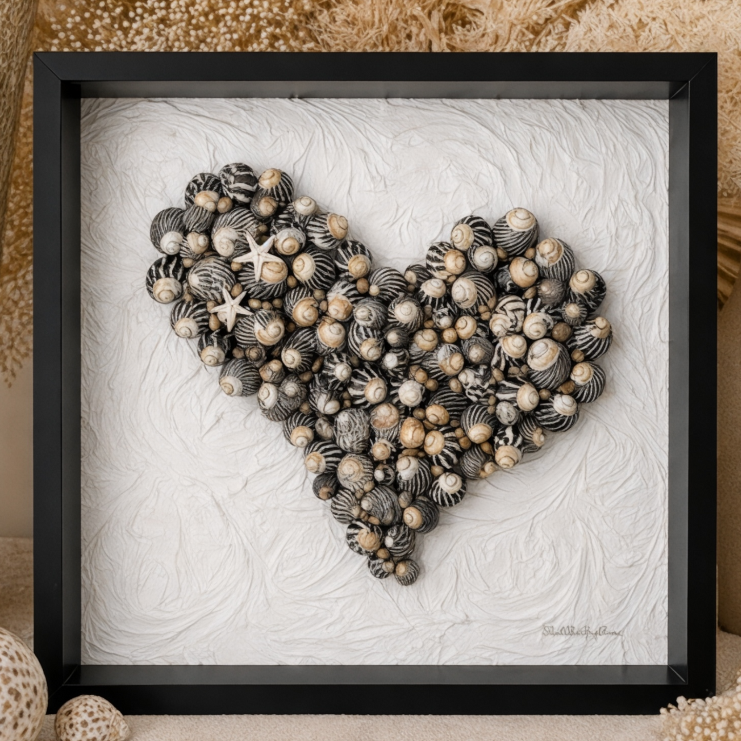 Handmade black and white wall art made from zebra sea snails and starfish in a black shadow box frame with textured background. Coastal wall art keepsake  for Mother’s Day, Valentine’s Day, Birthday gift. 
