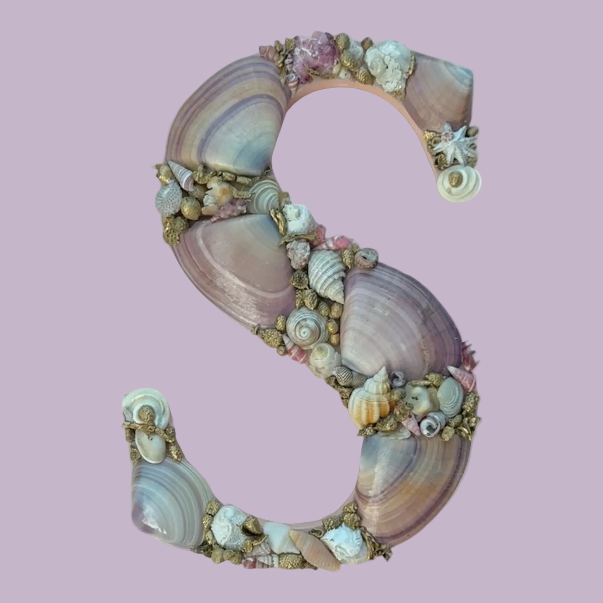 Decorative shell art initial S, handmade with natural pink, white and gold coated seashells. An unframed personalised coastal keepsake gift for a baby nursery, bedroom decor or door sign. available in all letters and made to order.