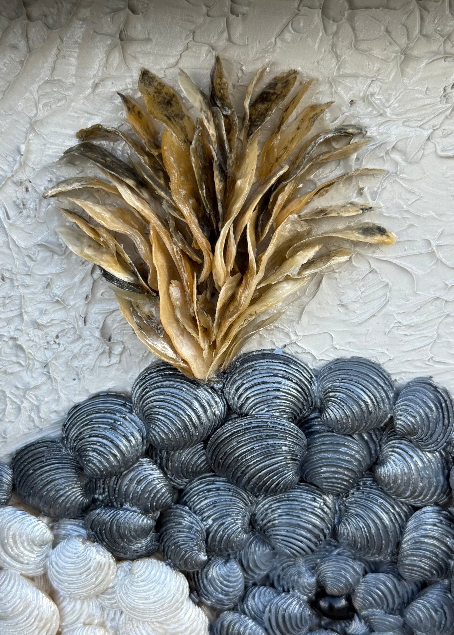 Detailed close up of playful whale seashell wall art. Bedroom coastal shell art framed.